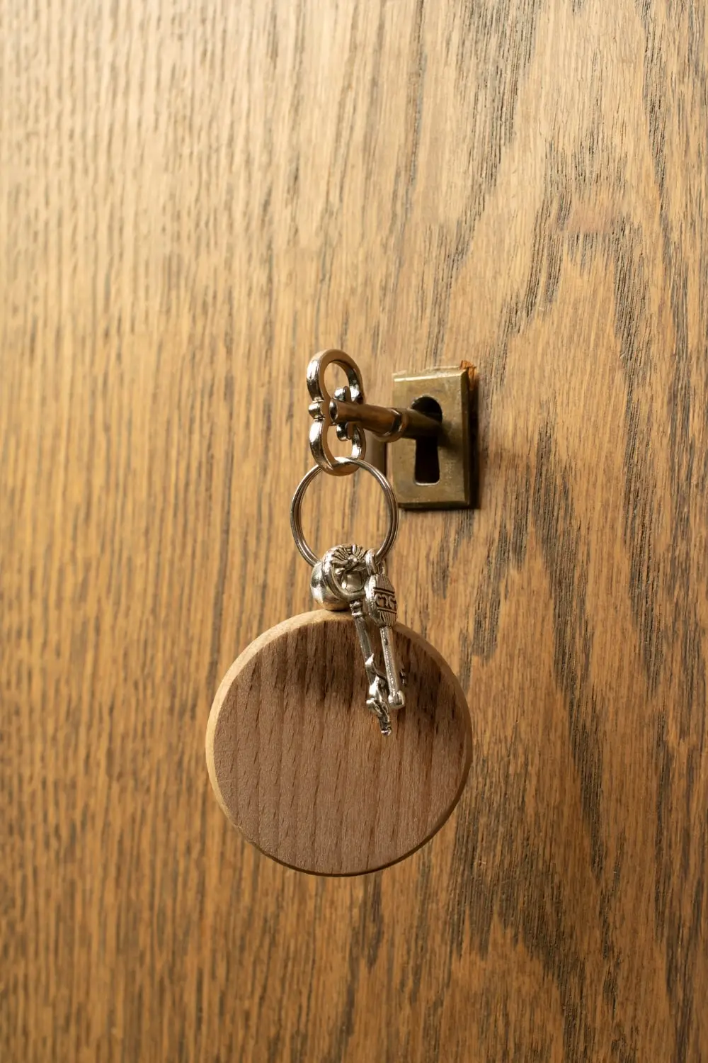 A golden key inserted in a door lock.